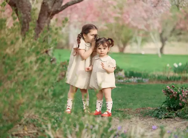 Two sisters among spring blossoms, outdoor photography by Photoholic, Rockland County NY